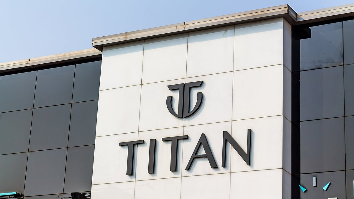 A Titan jewellery showroom in India displaying gold ornaments and premium watches - null
