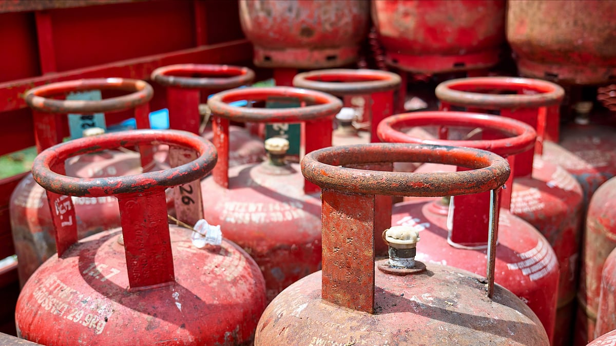 Domestic LPG cylinders stacked outside a distribution centre amid subsidy verification checks in India - null