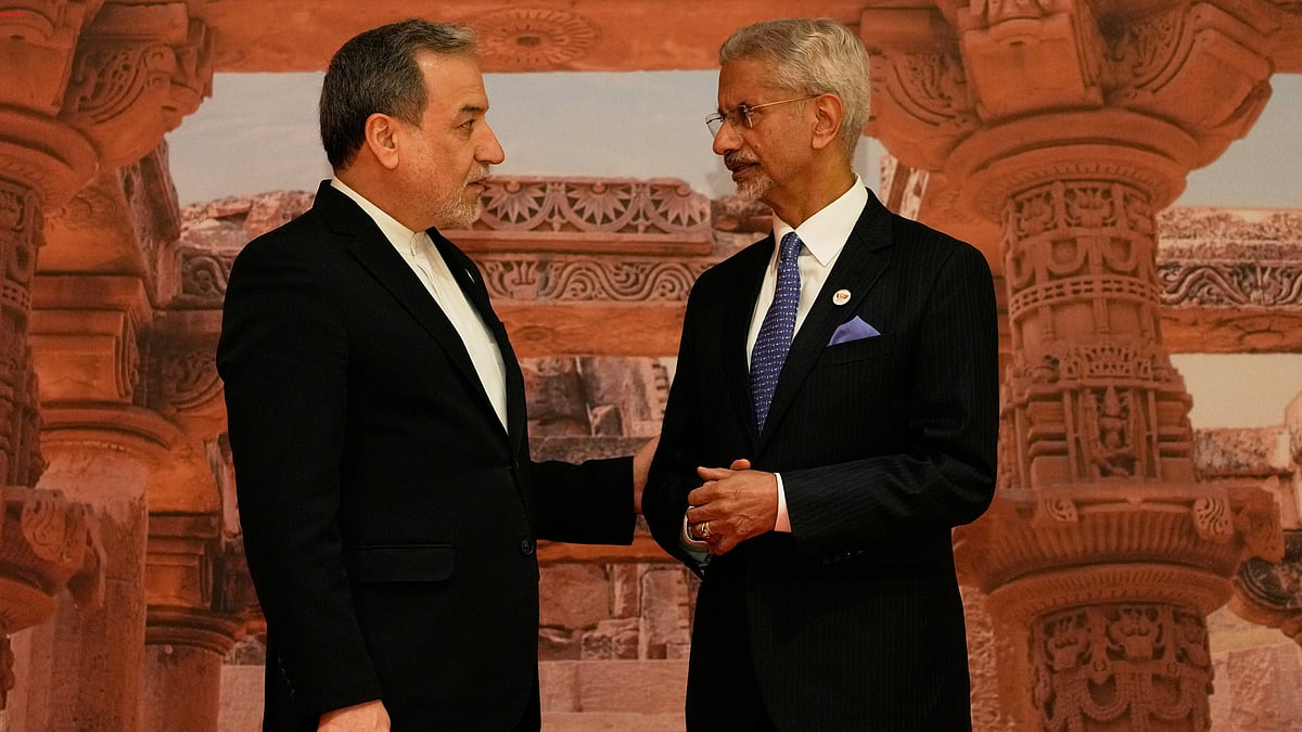 India's Foreign Minister S. Jaishankar, right, speaks with Iranian Foreign Minister Abbas Araghchi as he arrives for a two-day BRICS nations meeting in New Delhi, India - Photo by AP