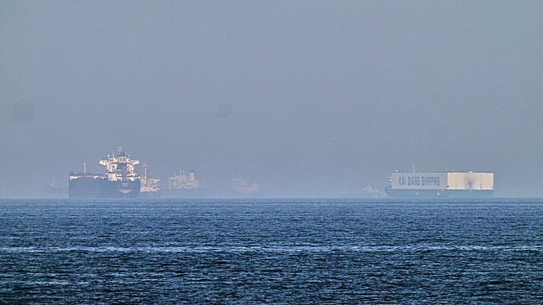 Oil tankers navigating the Strait of Hormuz with global energy flows highlighted - Photo by AP