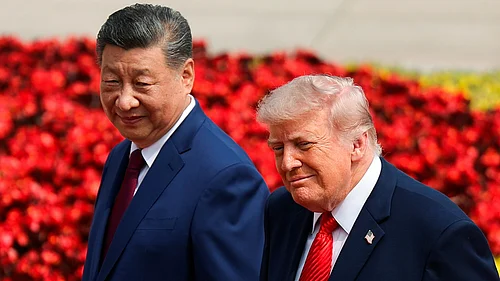 Maxim Shemetov : US President Donald Trump (right) and Chinese President Xi Jinping attend a welcome ceremony at the Great Hall of the People in Beijing