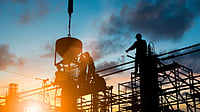 High-rise buildings and construction sites reflecting global urban expansion and emissions challenge