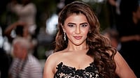 Manasi Pawar smiling with long wavy hair at Cannes