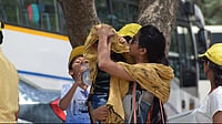 People shield themselves from extreme heat during a severe heatwave across northern India