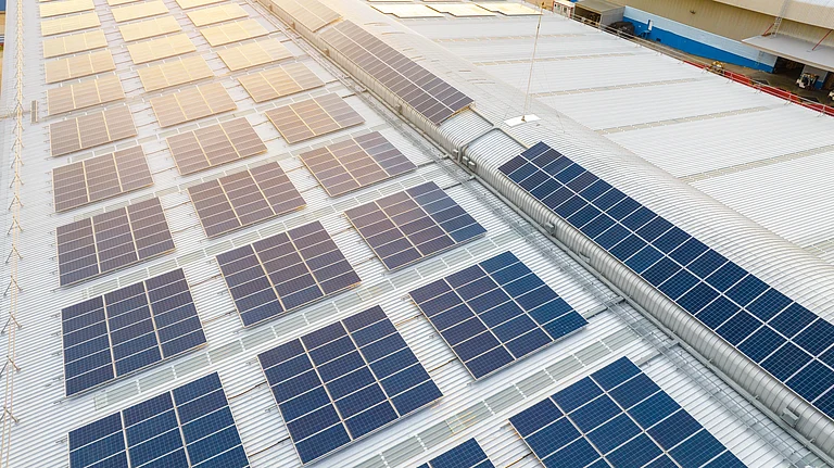 Solar panels at a renewable energy project site in India - null