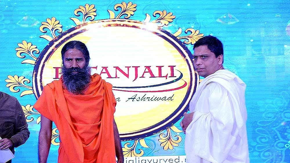 Ramdev and Archarya Balkrishna ( From left to right ) - null