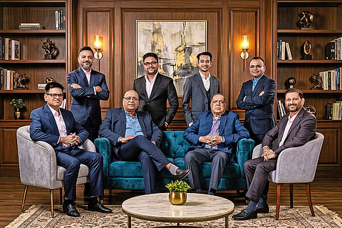 Generations of Excellence. (Standing, L-R) Mr. Avinash, Mr. Yash, Mr. Aditya & Mr. Priyank Singhania. (Seated, L-R) Mr. Mukesh, Mr. Arun, Mr. Naresh & Anand Singhania.