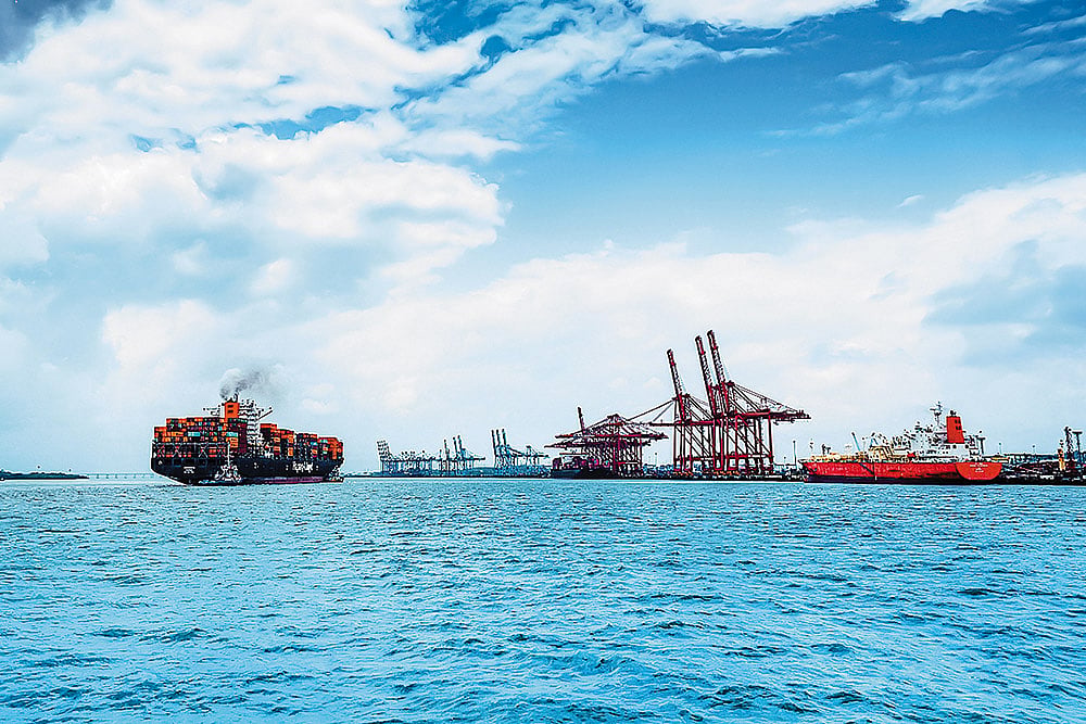 Steering global trade forward. A massive container vessel navigates the waters at JNPA, showcasing the scale of India’s premier container port. - null