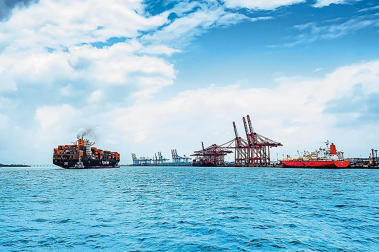 Steering global trade forward. A massive container vessel navigates the waters at JNPA, showcasing the scale of India’s premier container port. - null