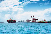 Beyond The Waterfront: JNPA’s Next Growth Story Steering global trade forward. A massive container vessel navigates the waters at JNPA, showcasing the scale of India’s premier container port.