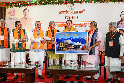 Uttarakhand Chief Minister Pushkar Singh Dhami being presented a memento during a two-day organisational meeting held by BJP Uttarakhand State Executive Committee (State Working Committee), at Haldwani, in Nainital district.