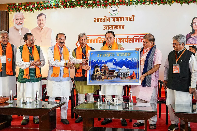 Uttarakhand Chief Minister Pushkar Singh Dhami being presented a memento during a two-day organisational meeting held by BJP Uttarakhand State Executive Committee (State Working Committee), at Haldwani, in Nainital district.
