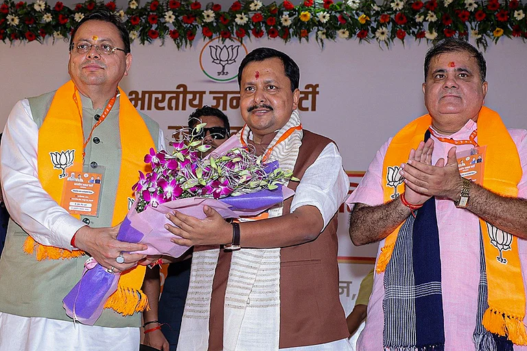 Uttarakhand CM Pushkar Singh Dhami, BJP National President Nitin Nabin and others during the BJP's Expanded State Executive Committee, in Haldwani. - | Photo: @NitinNabin/X via PTI