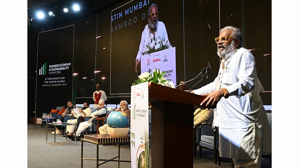 Pasha Patel speaks at the Summit as Governor Jishnu Dev Varma, Minister Bharat Sheth Gogawale and Dr. Faruk Patel look on.