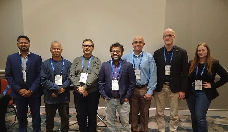 Dr. Shivaraman Ramaswamy (centre) with attendees at QuantEW 2026, organized by BBBS at IEEE MILCOM 2026 - null