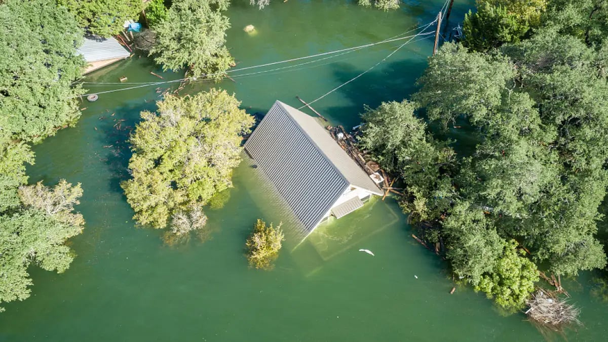 A house submerged in flood water in Central Texas