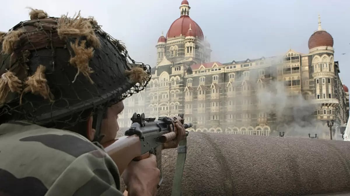 An Indian soldier keeping guard some distance from the Taj Hotel during the 26/11 attacks