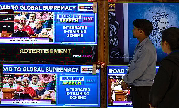 Getty Images : People watch Union Budget 2023-24 being presented by India's Finance Minister Nirmala Sitharaman in the Parliament