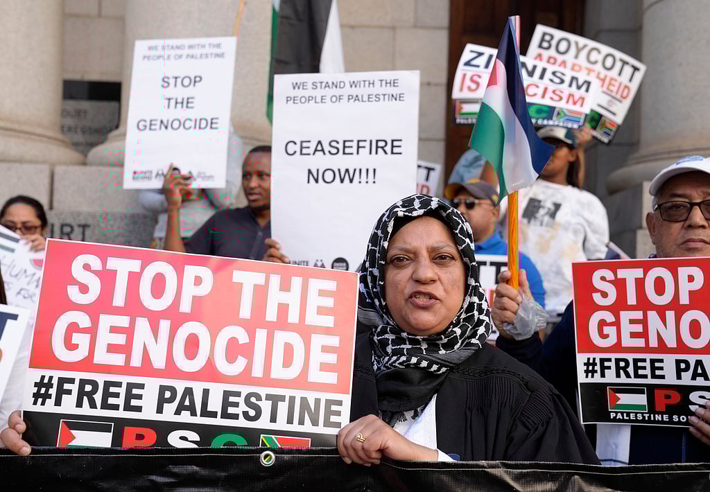 Demonstrators hold placards in support of South Africa’s case against Israel at the International Court of Justice (ICJ) of committing genocide against Palestinians in the Gaza Strip. - AP Photo/Nardus Engelbrecht, File