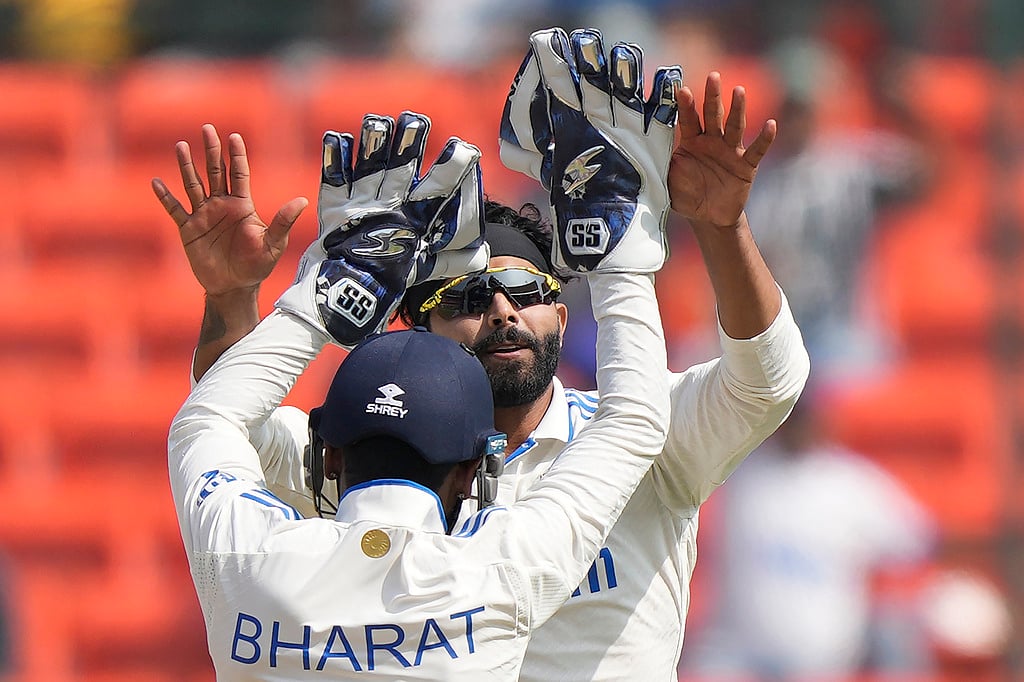 (AP Photo/Mahesh Kumar A.) : India's Ravindra Jadeja, facing the camera, celebrates the wicket of England's Mark Wood on the fourth day of the first cricket test match between England and India in Hyderabad, India, Sunday, Jan. 28, 2024. 