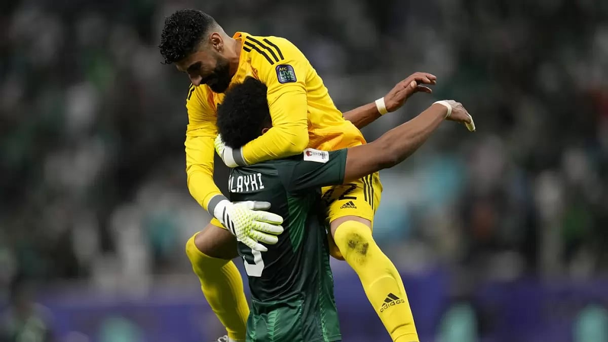 AP : Saudi Arabia's goalkeeper Ahmed Alkassar, top, celebrates with the scorer of the second goal Al Albulayhi after their AFC Asian Cup Group F football match against Oman at Khalifa International Stadium in Doha, Qatar