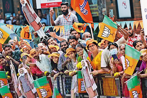 People greeting Modi as he arrives in Thriprayar in Thrissur district on January 17, 2024
