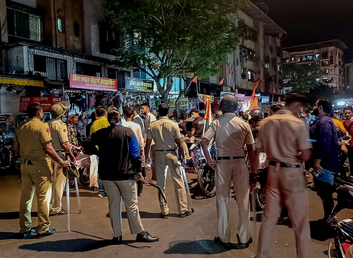 - : Police personnel stand guard after tension arisen between two groups over the Ayodhya's Ram Temple event, in Mumbai. Photo by PTI