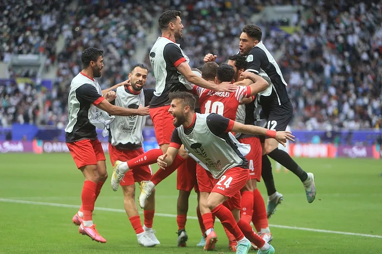 AFC Asian Cup 2023: Jordan players celebrate against Iraq - AP/ Hussein Sayed