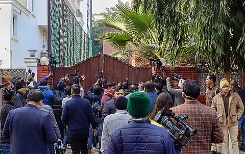 Media outside Jharkhand Chief Minister Hemant Soren's residence where an ED team reached, in New Delhi, Monday