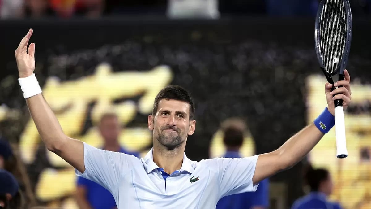 AP : Novak Djokovic of Serbia reacts after defeating Adrian Mannarino of France in their fourth-round match at the Australian Open tennis championships at Melbourne Park, Melbourne, Australia, Sunday, Jan. 21, 2024. 