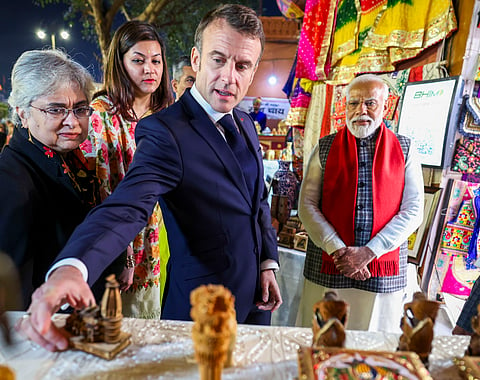 PM Modi and Macron in a market