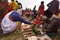 Getty Images : A tribal woman from the Tiwa community exchanges goods in the form of barter system