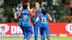 Photo: X/ wplt20 : Marizanne Kapp celebrating with her teammates after taking the wicket of Smriti Mandhana.