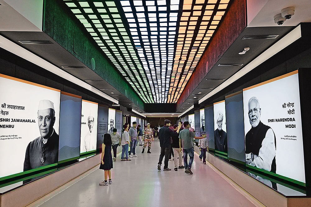 Photo: Getty Images : Opposite Ends: Photographic projections of Jawaharlal Nehru and Narendra Modi at the Pradhanmantri Sangrahalaya in Delhi
