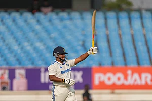 (AP Photo/Ajit Solanki) : India's Sarfaraz Khan celebrates his fifty runs on the first day of the third cricket test match between India and England in Rajkot, India, Thursday, Feb. 15, 2024.