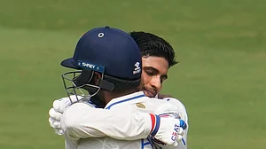 (AP Photo/Manish Swarup) : India's Shubman Gill celebrates his century with India's Axar Patel, in the helmet, on the third day of the second test match between India and England, in Visakhapatnam, India, Sunday, Feb. 4, 2024.