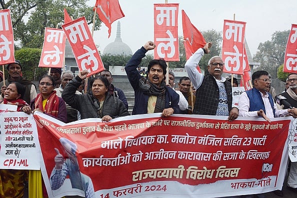 (Photo by Santosh Kumar/Hindustan Times via Getty Images) : CPI-ML Members taking out protest march in protest against life imprisonment for party MLA Manoj Manzil in murder case, at Buddha Smriti Park on February 14, 2024 in Patna, India. 