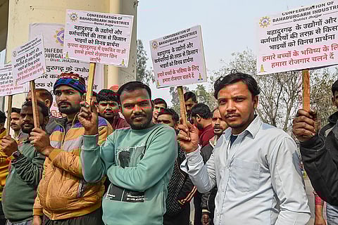 Industrial workers concerned about their livelihood