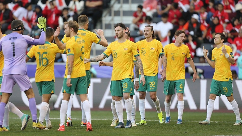 AP Photo/Hussein Sayed         : Australia's Graig Goodwin, 1st right, celebrates with his teammates after scoring the third goal during the Asian Cup round of 16 football match against Indonesia.