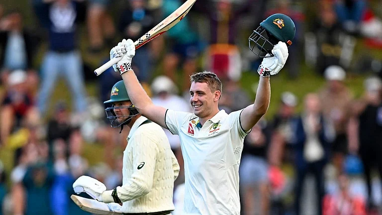 Australia's Cameron Green celebrates scoring a century against New Zealand on the first day of their first Test match in Wellington, on February 29, 2024. - AP