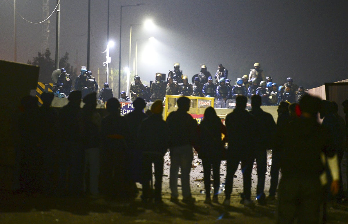 PTI : Patiala: Security personnel stand guard at a roadblock at the Shambhu Border amid farmers' protest