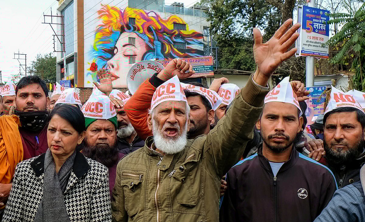 PTI Photo : Members of Uttarakhand Numainda Group protest against the Uniform Civil Code (UCC) bill during a special session of the Uttarakhand Legislative Assembly, in Dehradun. 