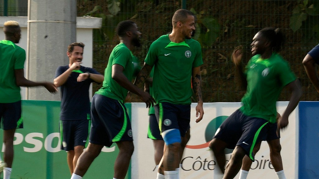 (AP Photo/Themba Hadebe) : Nigeria's players warm up for their training practice in Abidjan, Ivory Coast, Saturday, Feb. 10, 2024. Nigeria will play the African Cup of Nations final soccer match against Ivory Coast on Sunday, Feb. 11, 2024. 