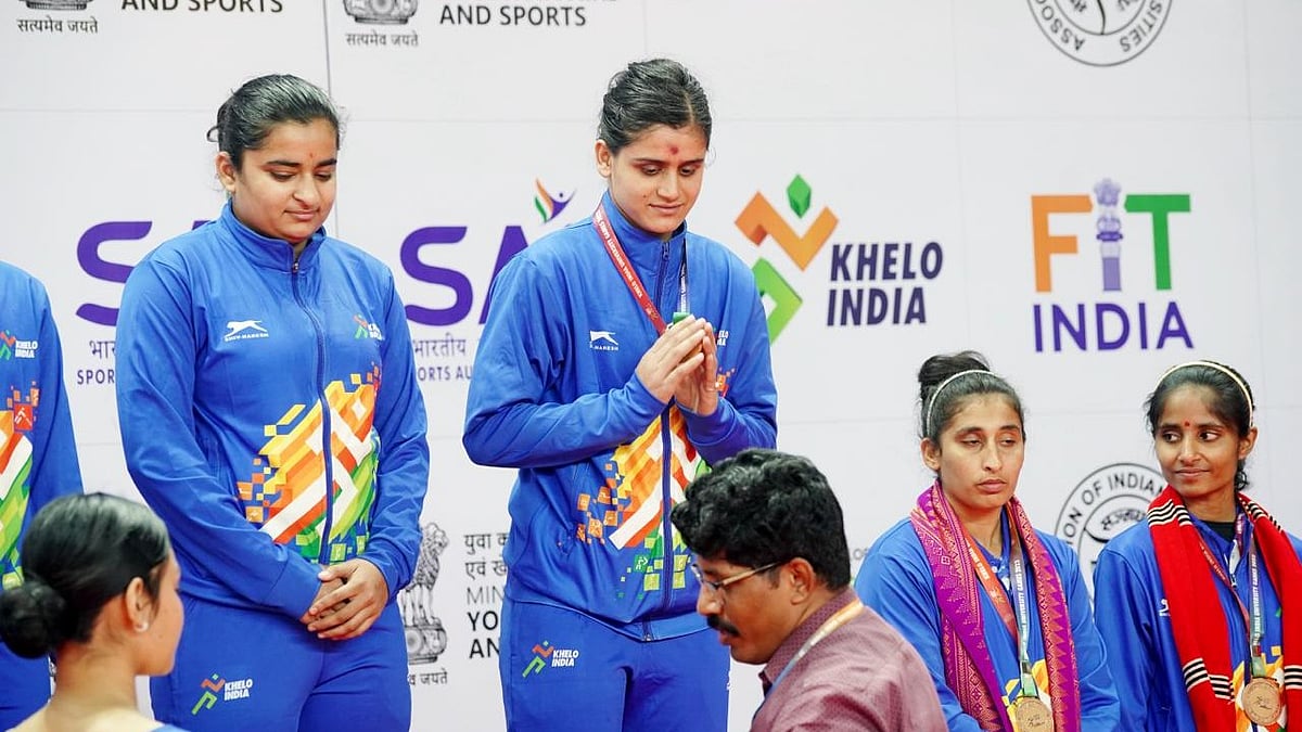 SAI Photo : Chandigarh University's Sakshi Sharma (centre) gestures after receiving the team gold in women's kabaddi in Khelo India University Games 2023 Ashtalakshmi, in Guwahati, on Thursday.