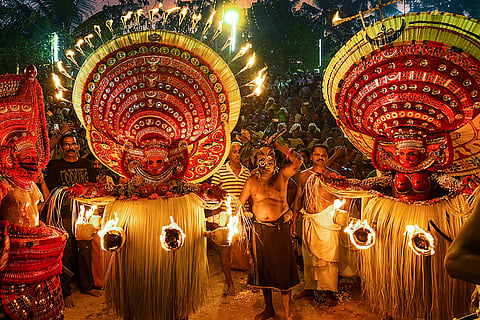 Theyyam artists perform