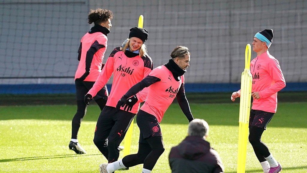 Photo: Martin Rickett/PA via AP : Manchester City's Erling Haaland, second left, Jack Grealish and Phil Foden, right, attend a training session at the City Football Academy in Manchester, ahead of their UEFA Champions League 2023-24 tie against Copenhagen.