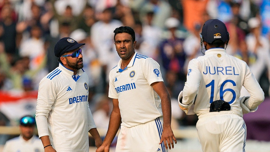 India's Ravichandran Ashwin, center, celebrates with captain Rohit Sharma, left, the wicket of England's James Anderson on Day 3 of their 4th Test match in Ranchi, February 25, 2024. - AP