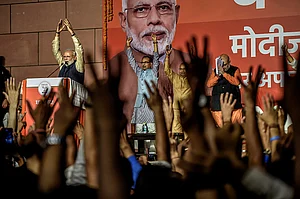Getty Images : Narendra Modi speaks to the victorious party workers at the BJP party head quarters in New Delhi, India |