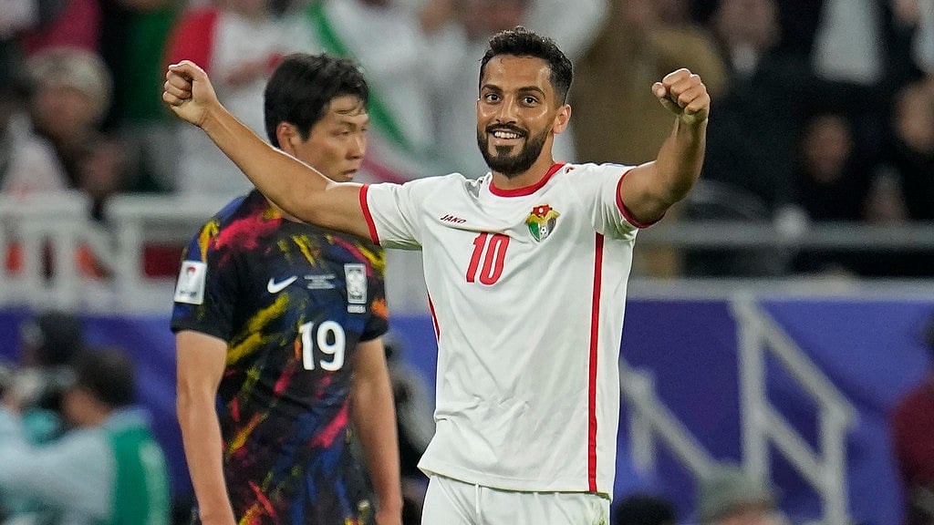 (AP Photo/Aijaz Rahi) : Jordan's Mousa Altamari, right, celebrates after their win in the Asian Cup semifinal soccer match between South Korea and Jordan at Ahmad Bin Ali Stadium in Al Rayyan, Qatar, Tuesday, Feb. 6, 2024. Jordan won 2-0. 

