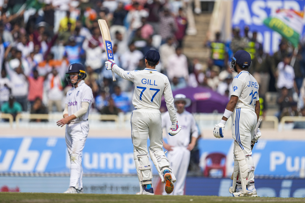 India's Shubman Gill, center celebrates his fifty runs on the fourth day of the fourth cricket test match between England and India in Ranchi, India, Monday, Feb. 26, 2024.